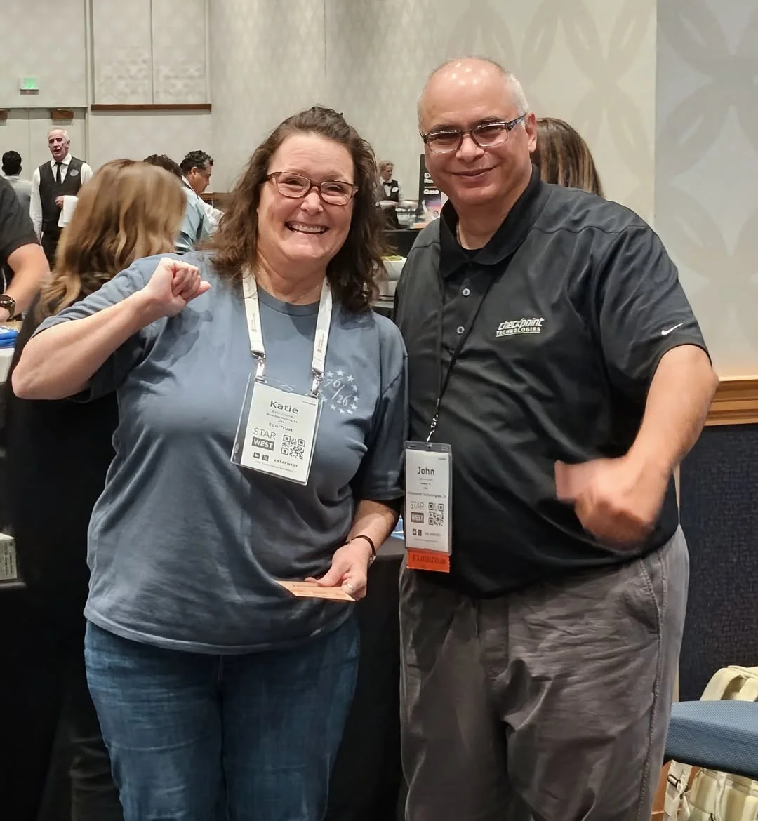 Two conference attendees posing together at STARWEST 2026.